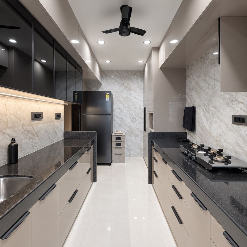 Galley kitchen with taupe gloss cabinets, a black granite counter, glass-front upper cabinets and a marble-look backsplash