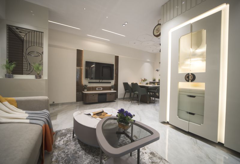 Living room with a television unit and the lit prayer unit beyond